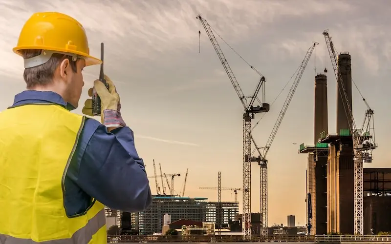 Construction professionals utilizing Volanti's touchscreen plan review table to streamline digital blueprint analysis and enhance on-site collaboration.